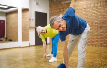 A senior fitness session: stretching for balance and mobility